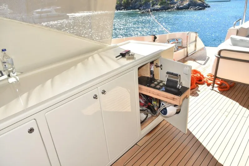  Yacht Photos Pics Luxurious 2007 Azimut 86S yacht deck with open storage, scenic ocean view.