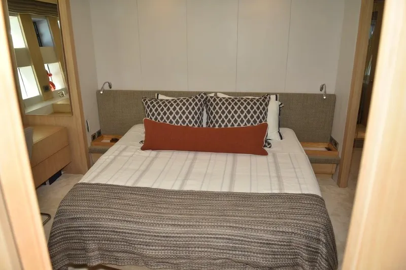  Yacht Photos Pics Luxurious bedroom interior of 2007 Azimut 86S yacht with elegant bedding and modern design.