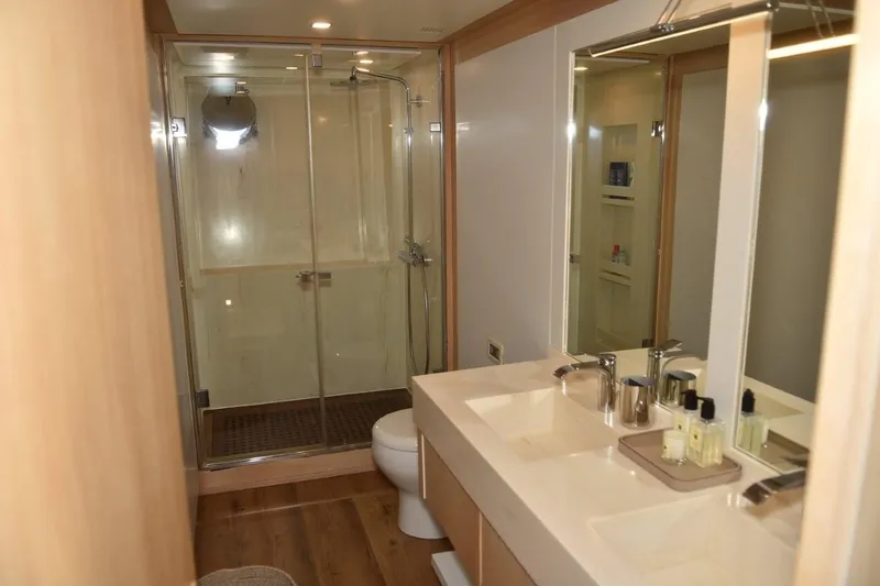  Yacht Photos Pics Luxurious bathroom in a 2007 Azimut 86S yacht with modern fixtures and spacious shower.