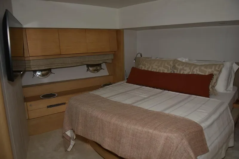  Yacht Photos Pics Luxurious bedroom interior of 2007 Azimut 86S yacht with cozy bedding and modern decor.