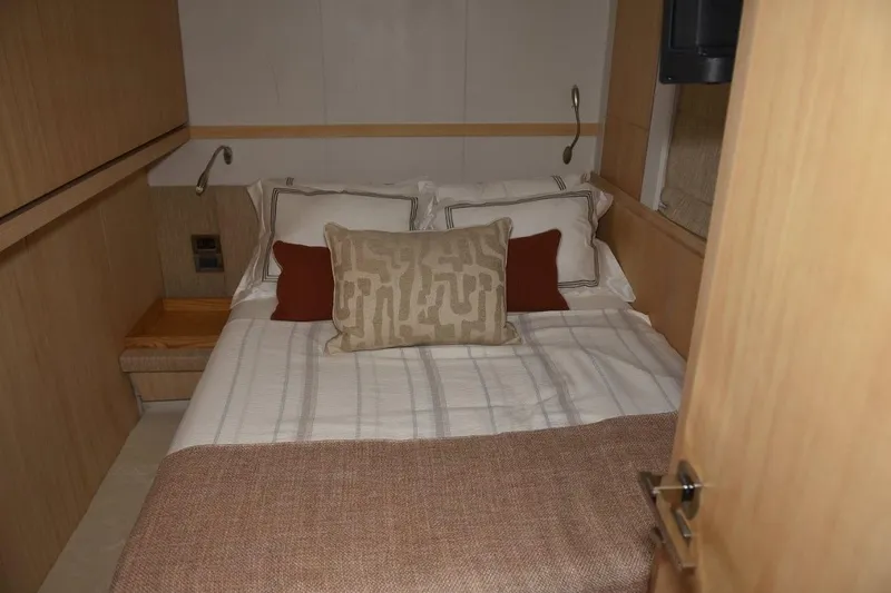  Yacht Photos Pics Luxurious bedroom interior of 2007 Azimut 86S yacht with cozy bedding and modern design.