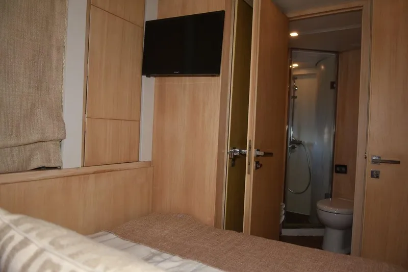  Yacht Photos Pics Interior of 2007 Azimut 86S yacht showing bedroom and ensuite bathroom.