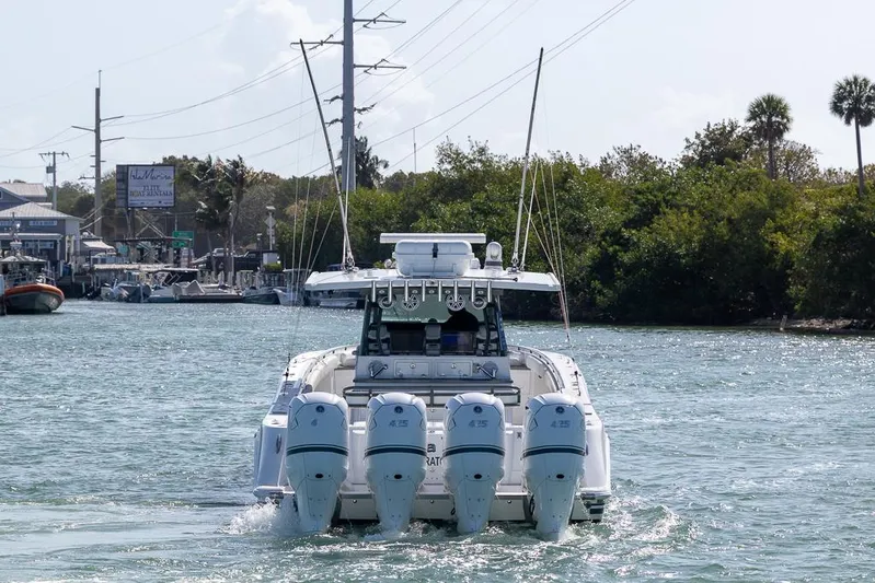  Yacht Photos Pics 2019 HCB 53 Sueños boat cruising on a waterway with four engines.