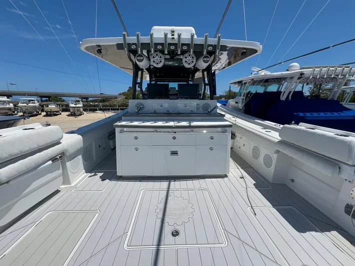  Yacht Photos Pics 2019 HCB 53 Sueños boat deck with seating and storage under clear blue sky.