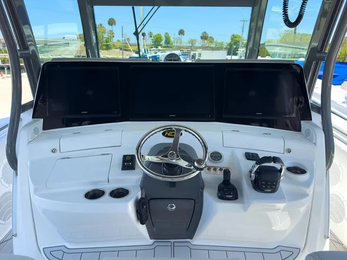  Yacht Photos Pics 2019 HCB 53 Sueños helm with steering wheel, controls, and multiple display screens.