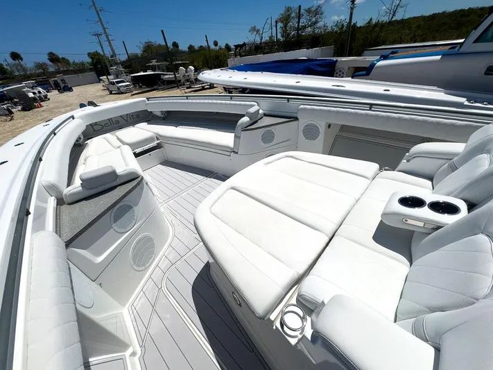  Yacht Photos Pics Luxurious 2019 HCB 53 Sueños boat interior with white seating and cup holders.