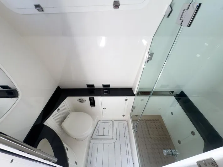  Yacht Photos Pics Luxurious bathroom interior of 2019 HCB 53 Sueños yacht with modern fixtures.