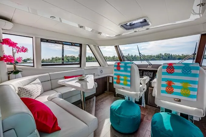 Family Tradition II Yacht Photos Pics Luxurious 2012 Neptunus Enclosed Bridge yacht interior with vibrant decor and scenic views.