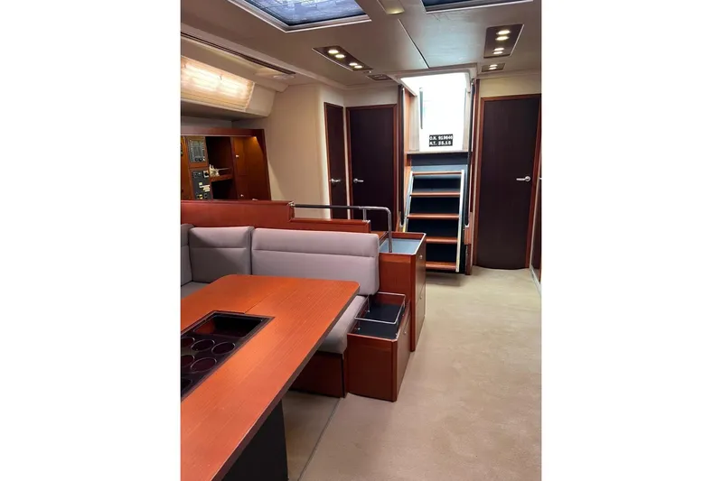  Yacht Photos Pics Interior of 2013 Hanse 575 yacht with modern seating and wooden finishes.
