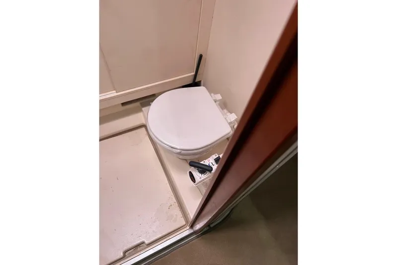  Yacht Photos Pics Compact bathroom on 2013 Hanse 575 yacht with toilet and shower area.