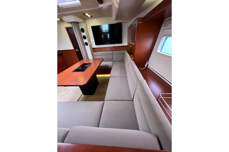  Yacht Photos Pics Luxurious interior of 2013 Hanse 575 yacht with modern seating and entertainment area.