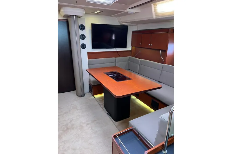  Yacht Photos Pics Luxurious interior of 2013 Hanse 575 yacht with modern dining area and TV.