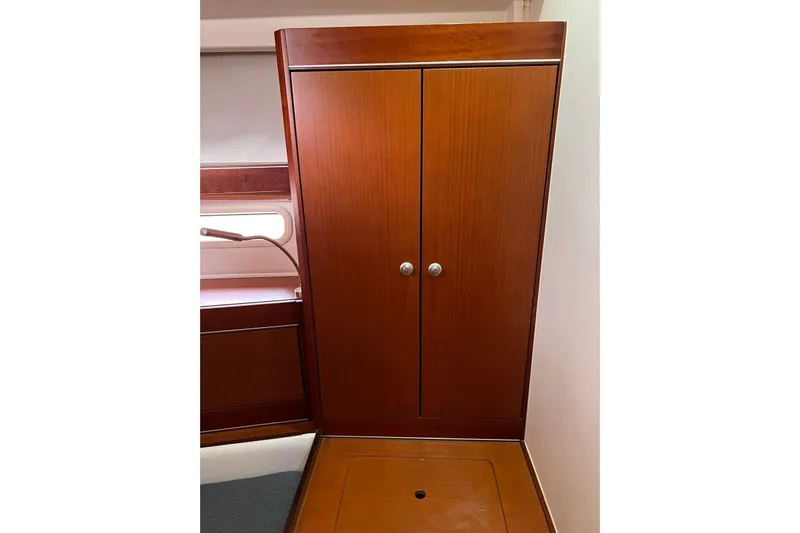  Yacht Photos Pics Wooden cabinet inside 2013 Hanse 575 yacht, featuring sleek design and modern finish.