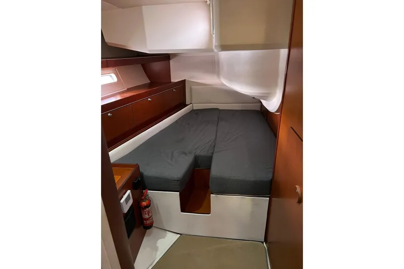  Yacht Photos Pics Cozy cabin interior of 2013 Hanse 575 yacht with bed and storage.