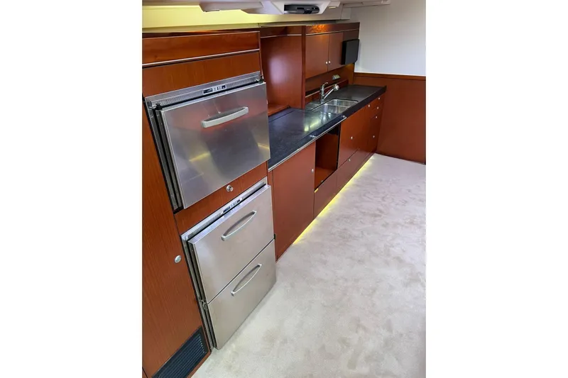  Yacht Photos Pics Modern kitchen in 2013 Hanse 575 yacht with stainless steel appliances and sleek cabinetry.