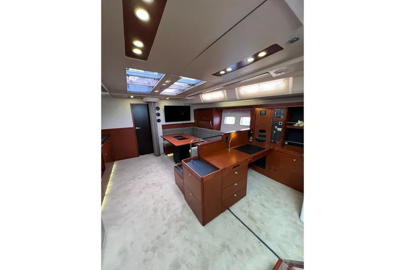  Yacht Photos Pics Luxurious interior of 2013 Hanse 575 yacht with modern design and ample natural light.
