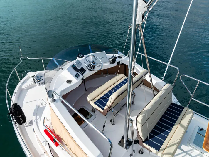 Toujours Yacht Photos Pics 2021 Ranger Tugs R-31 CB boat with spacious deck and seating on calm water.