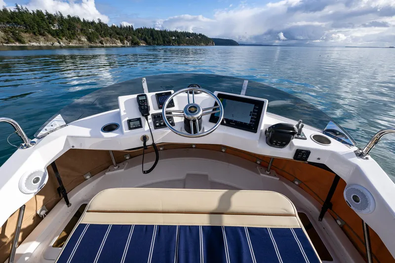Toujours Yacht Photos Pics 2021 Ranger Tugs R-31 CB helm with scenic ocean view.