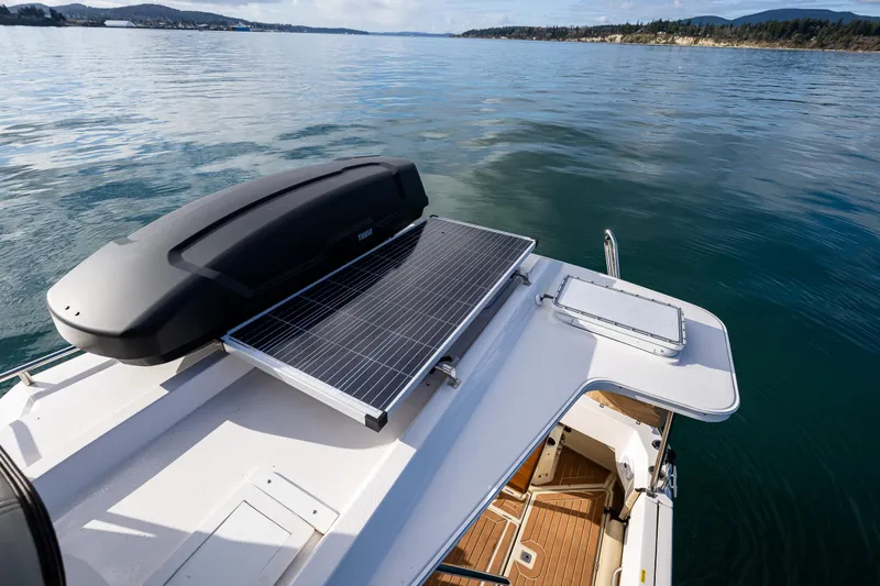 Toujours Yacht Photos Pics Ranger Tugs R-31 CB 2021 with solar panel on deck, cruising on calm waters.