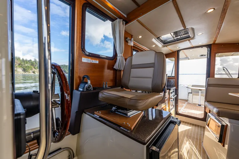 Toujours Yacht Photos Pics Interior of 2021 Ranger Tugs R-31 CB boat with modern seating and wood accents.