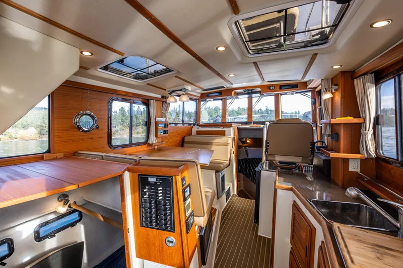 Toujours Yacht Photos Pics Interior of 2021 Ranger Tugs R-31 CB boat with wood accents and modern amenities.