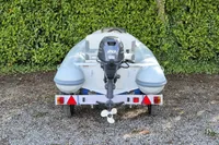 2022 AB Inflatables 9.5 Alx boat on trailer, rear view, with outboard motor.