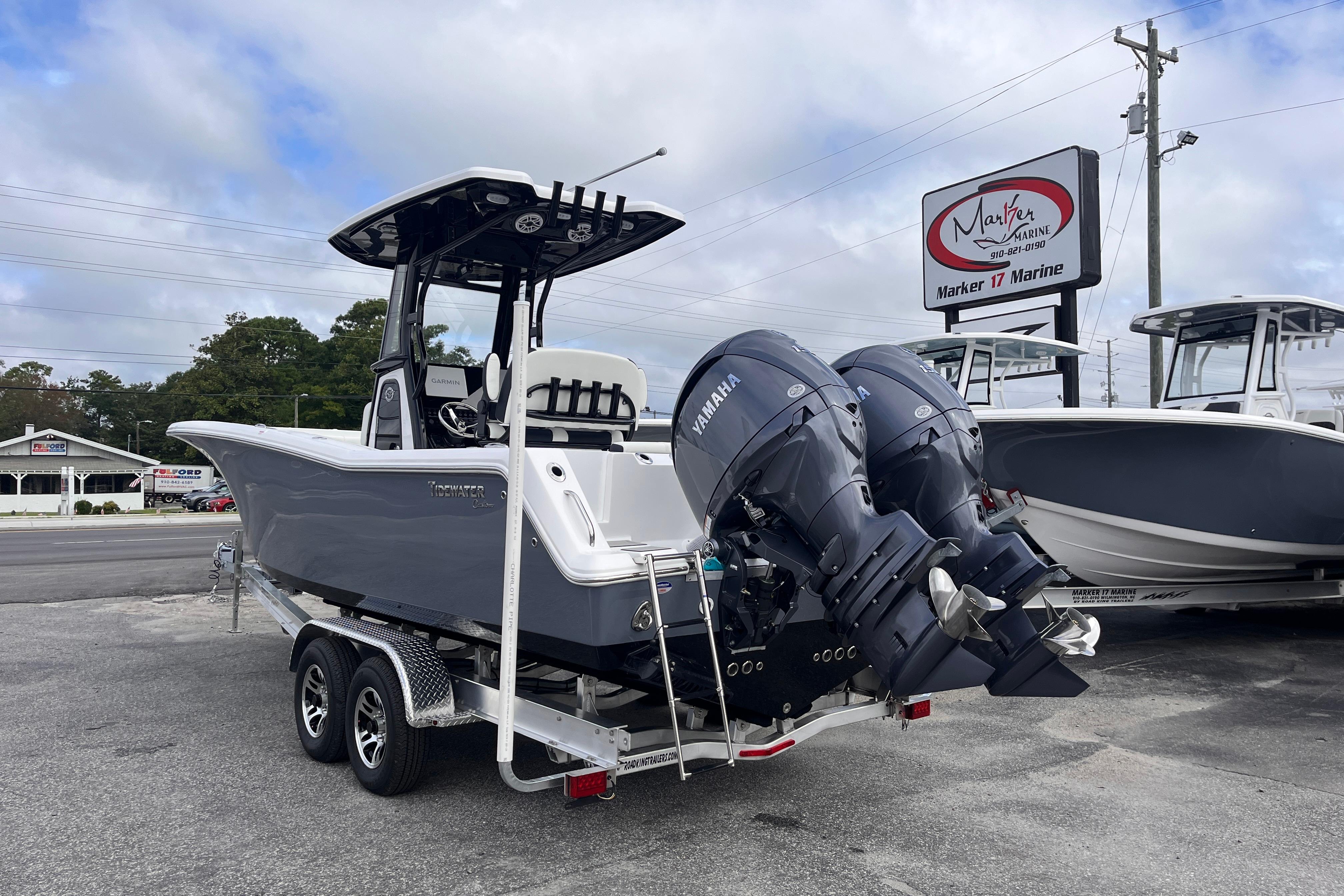 2026 Tidewater 256 CC Adventure boat with dual Yamaha engines on a trailer.