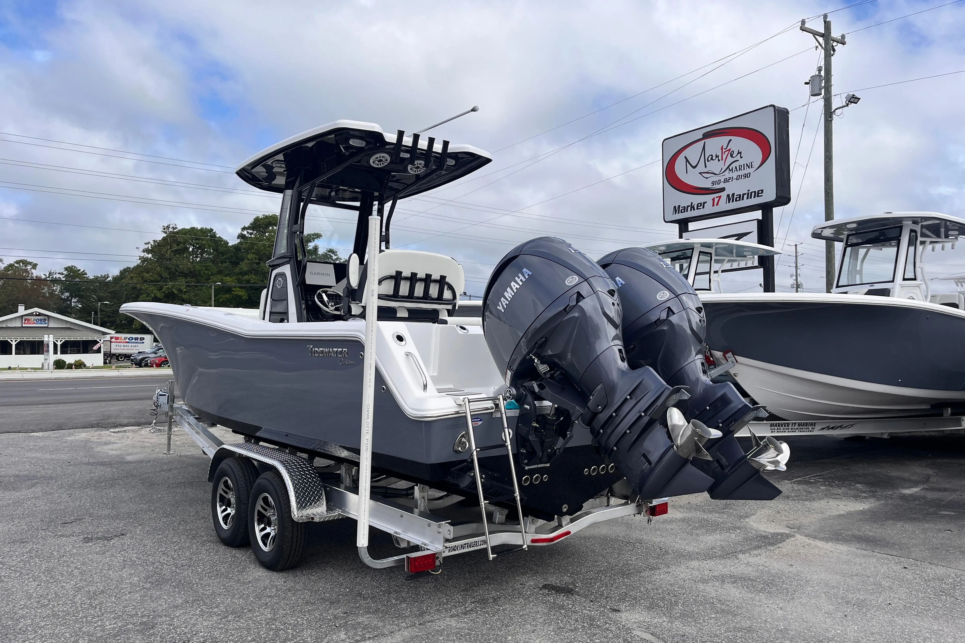 2026 Tidewater 256 CC Adventure boat with dual Yamaha engines on a trailer.