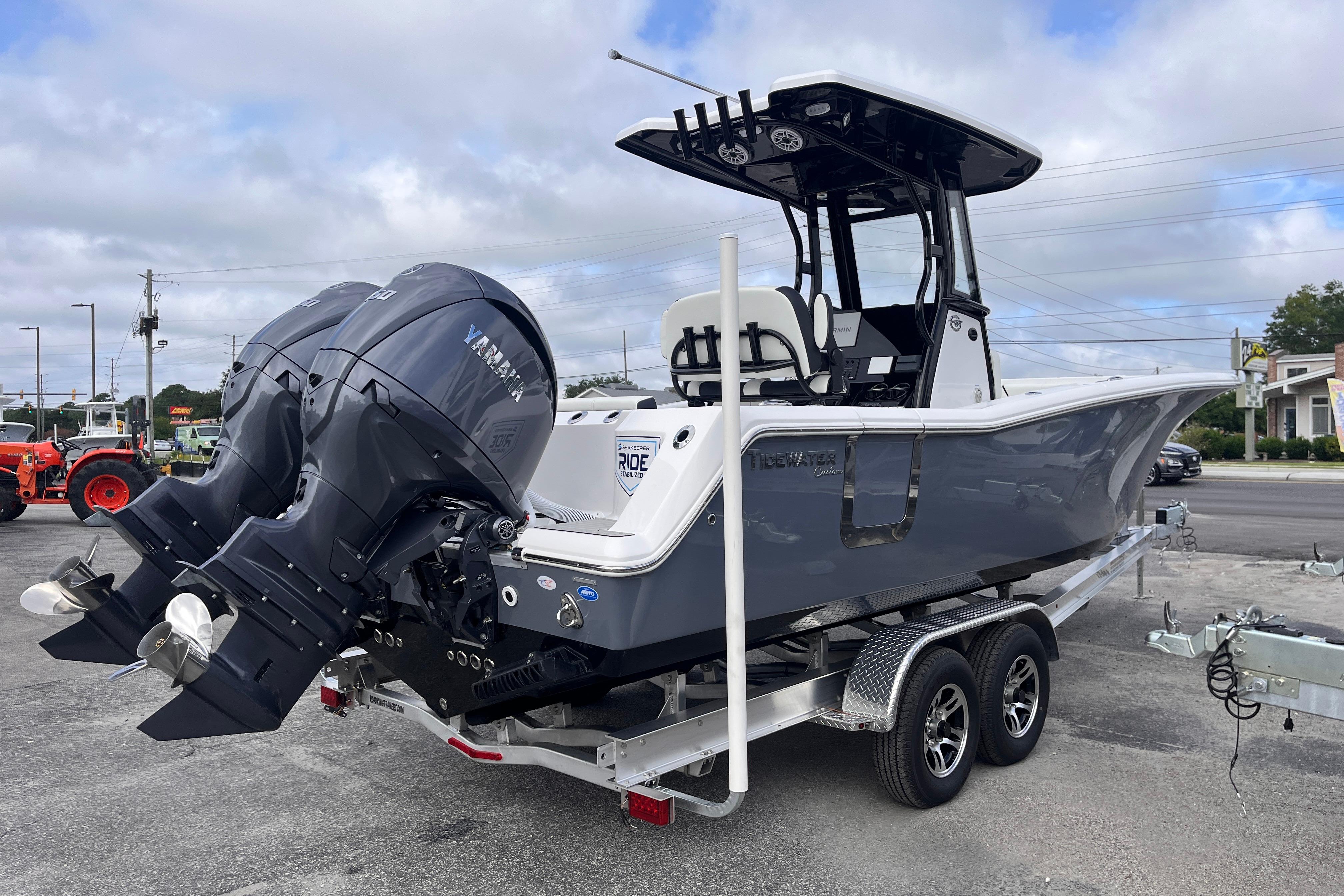 2026 Tidewater 256 CC Adventure boat with dual Yamaha engines on a trailer.
