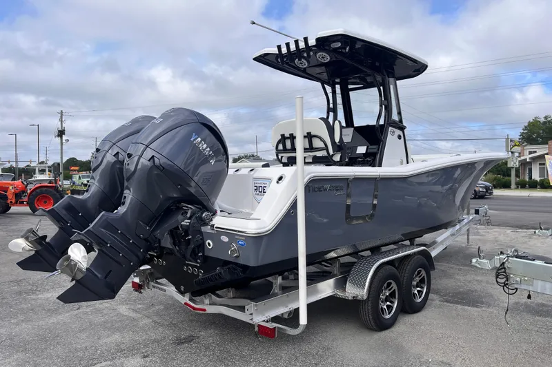  Yacht Photos Pics 2026 Tidewater 256 CC Adventure boat with dual Yamaha engines on a trailer.