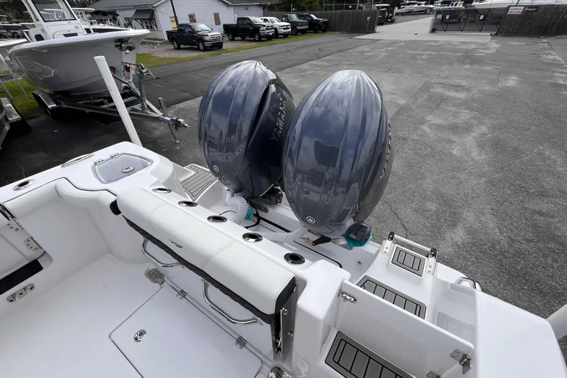  Yacht Photos Pics 2026 Tidewater 256 CC Adventure boat with dual outboard engines in a marina setting.