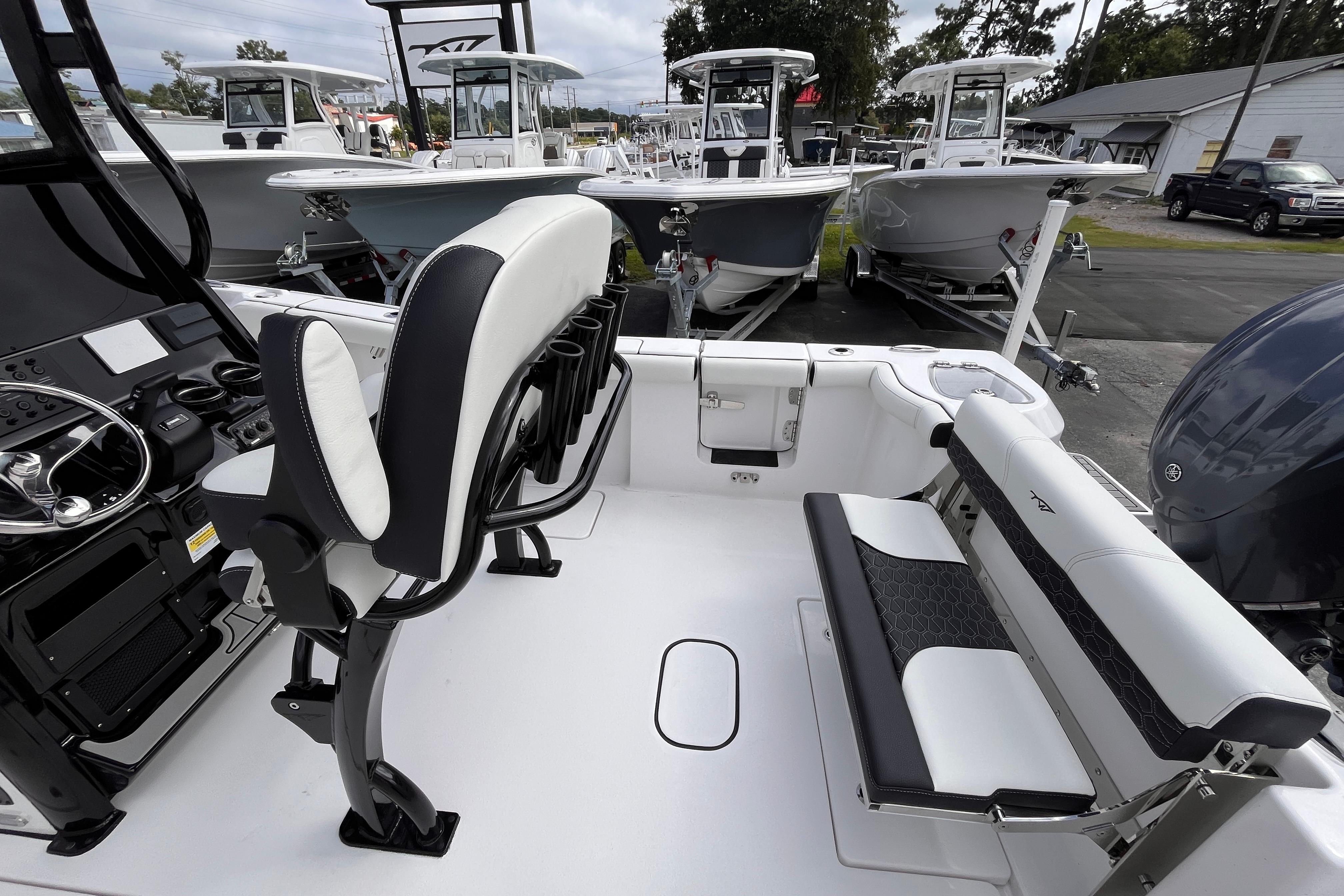 2026 Tidewater 256 CC Adventure boat interior with seating and control panel.
