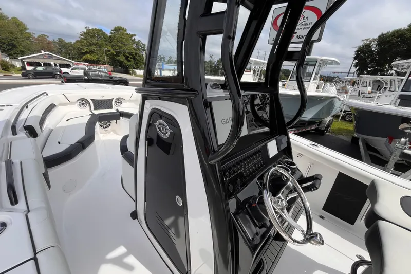 Yacht Photos Pics 2026 Tidewater 256 CC Adventure boat interior with sleek design and modern controls.