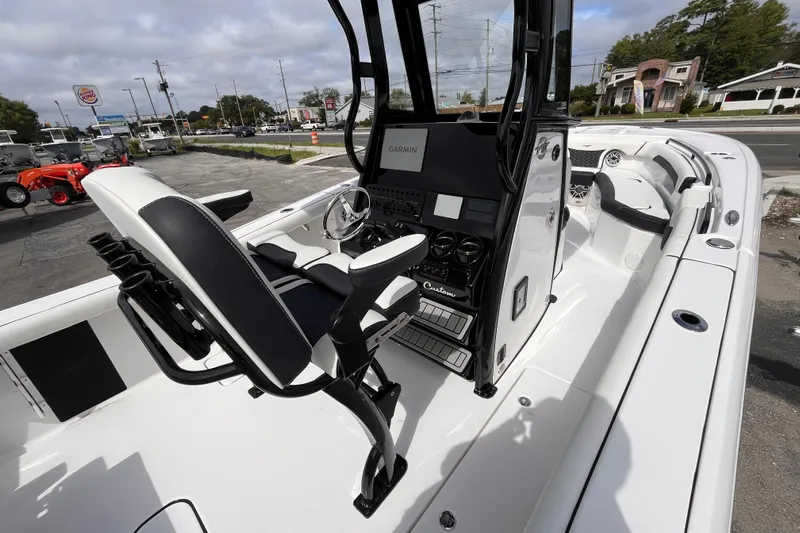  Yacht Photos Pics 2026 Tidewater 256 CC Adventure boat interior with modern console and seating.