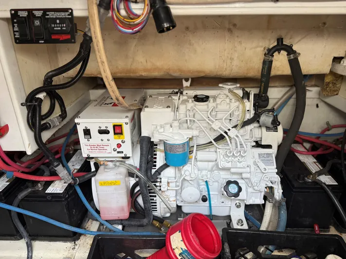 Lures & Liars Yacht Photos Pics Engine compartment of a 2002 Miller Marine Express boat, featuring wiring and components.