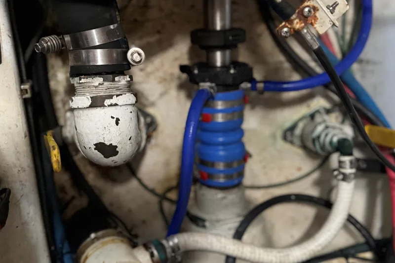 Lures & Liars Yacht Photos Pics Engine room of 2002 Miller Marine Express with visible pipes and fittings.