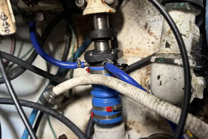 Lures & Liars Yacht Photos Pics Engine compartment of a 2002 Miller Marine Express with visible hoses and fittings.