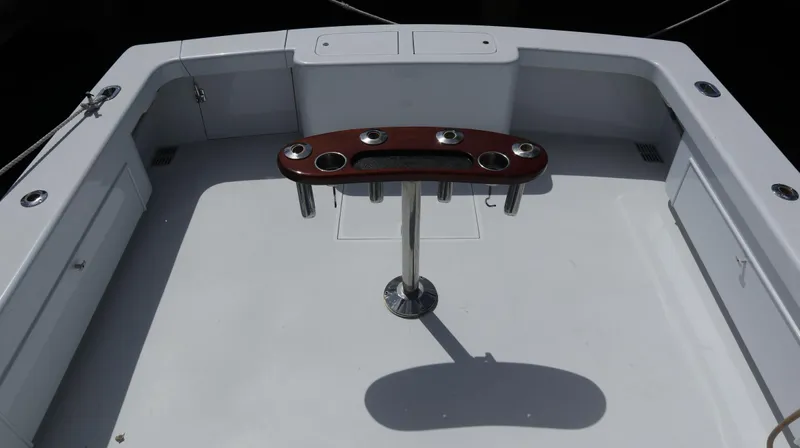 Lures & Liars Yacht Photos Pics 2002 Miller Marine Express boat deck with rod holders and clean layout.