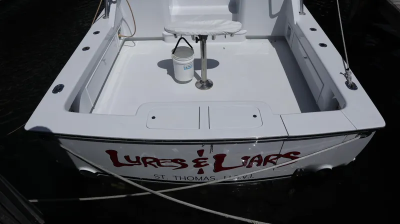 Lures & Liars Yacht Photos Pics 2002 Miller Marine Express boat with "Lures & Liars" text, docked in St. Thomas.