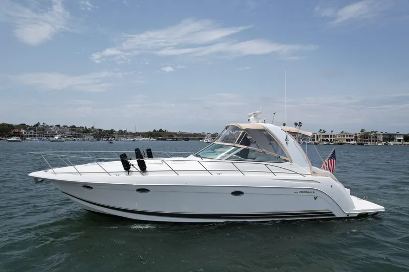 Aloha Spirit Yacht Photos Pics 2003 Formula 40 PC yacht cruising on a sunny day with clear skies.