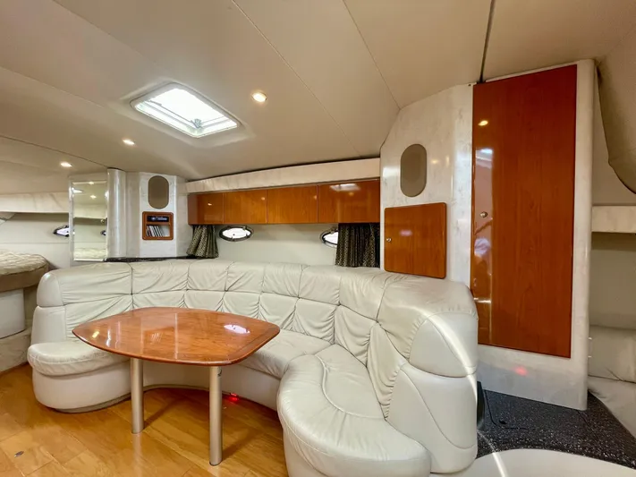 Aloha Spirit Yacht Photos Pics 2003 Formula 40 PC yacht interior with leather seating and wooden table.