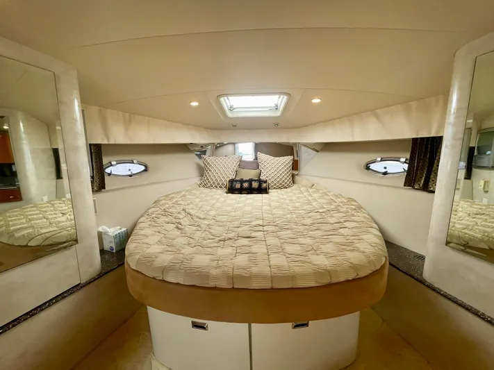 Aloha Spirit Yacht Photos Pics Luxurious cabin interior of 2003 Formula 40 PC yacht with cozy bed and porthole windows.