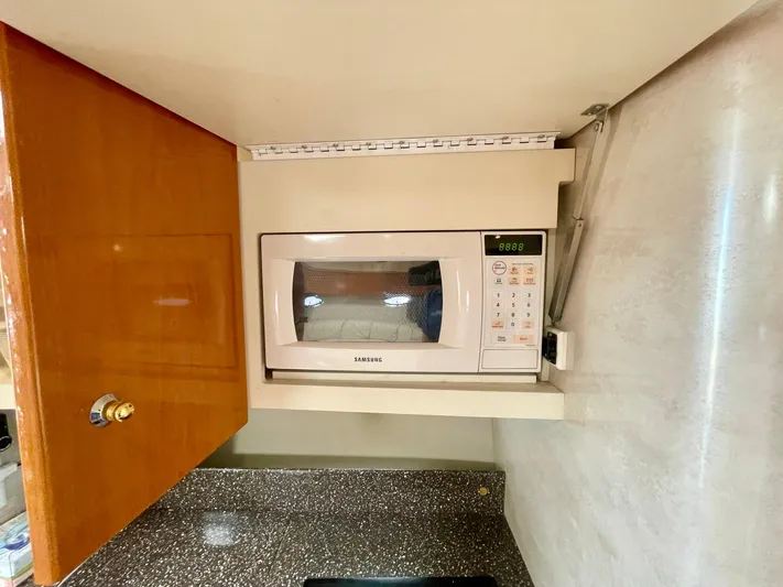 Aloha Spirit Yacht Photos Pics Built-in microwave in 2003 Formula 40 PC yacht kitchen cabinet.