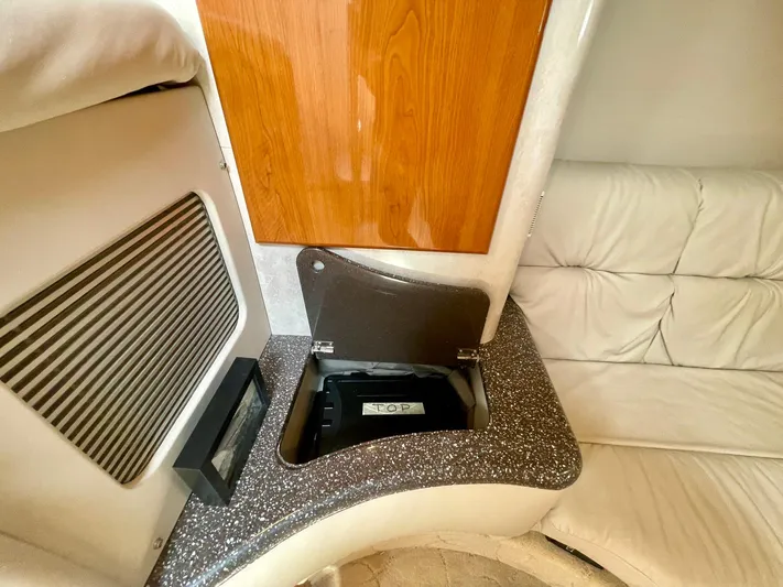 Aloha Spirit Yacht Photos Pics 2003 Formula 40 PC yacht interior with storage compartment and cushioned seating.