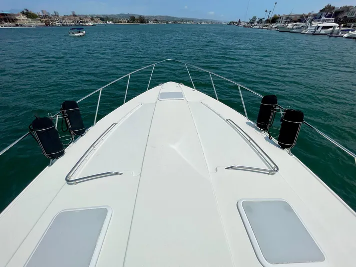 Aloha Spirit Yacht Photos Pics Bow view of 2003 Formula 40 PC yacht on calm water.