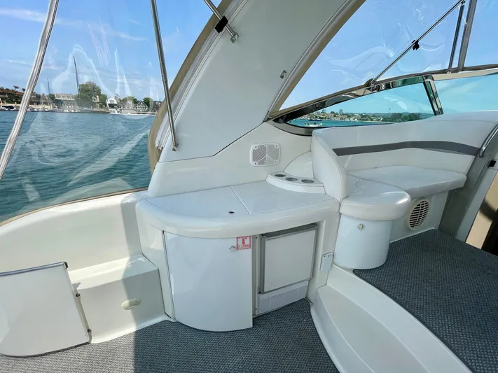 Aloha Spirit Yacht Photos Pics 2003 Formula 40 PC yacht interior with seating and storage, overlooking serene waters.