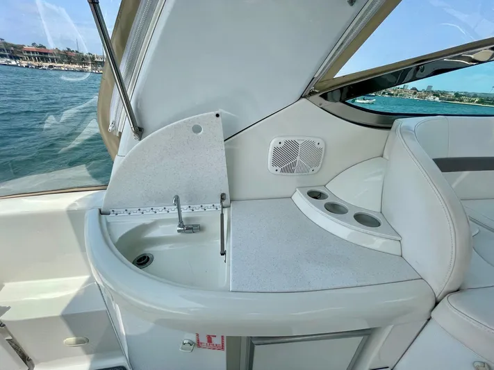 Aloha Spirit Yacht Photos Pics 2003 Formula 40 PC yacht interior with sink and seating area by the water.