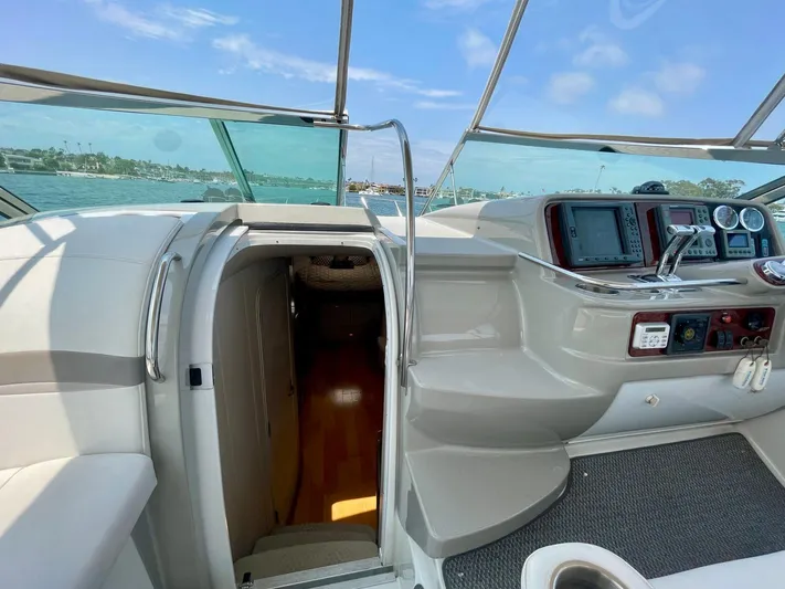 Aloha Spirit Yacht Photos Pics 2003 Formula 40 PC yacht cockpit with navigation controls and cabin entrance.