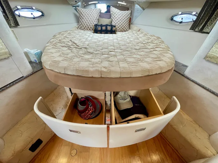 Aloha Spirit Yacht Photos Pics Interior of 2003 Formula 40 PC yacht with bed and open storage drawers.