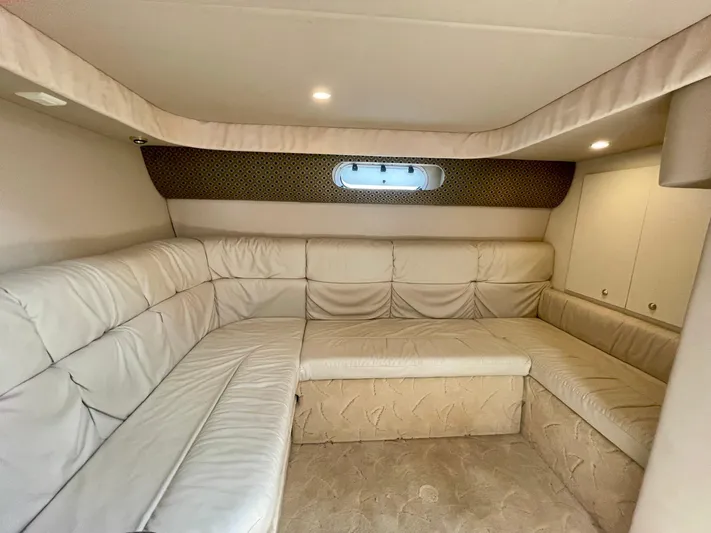Aloha Spirit Yacht Photos Pics Interior of 2003 Formula 40 PC yacht with beige leather seating and ambient lighting.
